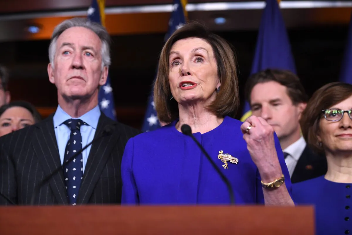 Speaker of the House Nancy Pelosi (D-Calif.) and (L) House Ways and Means Committee Chairman Richard Neal (D-Mass.) speak about the U.S.-Mexico-Canada Agreement, known as the USMCA, on Capitol Hill in Washington, on Dec. 10, 2019. (Saul Loeb/AFP via Getty Images)