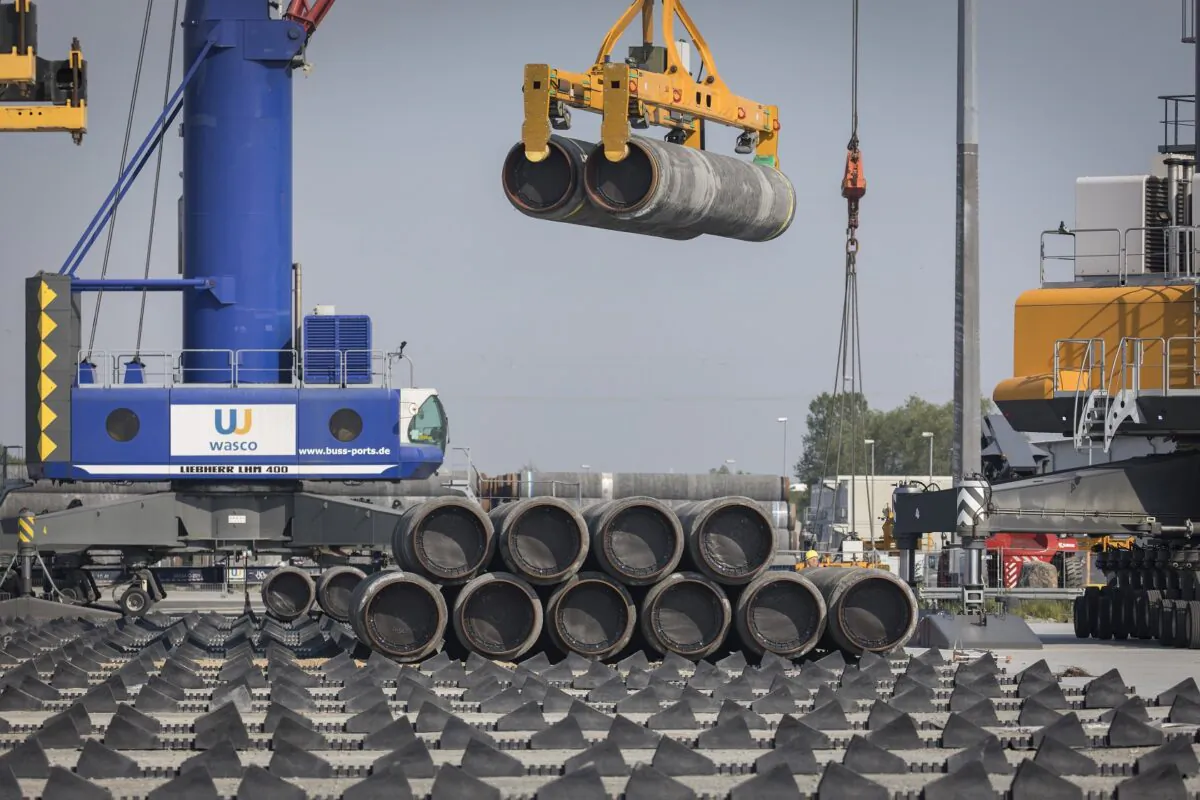 A crane moves Nord Stream 2 pipes at the Mukran port near Sassnitz, Germany, on June 5, 2019. (Axel Schmidt/Getty Images)