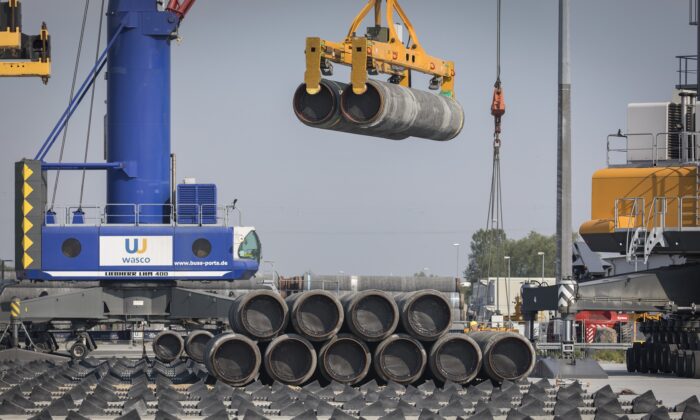 A crane moves Nord Stream 2 pipes at the Mukran port near Sassnitz, Germany, on June 5, 2019. (Axel Schmidt/Getty Images)