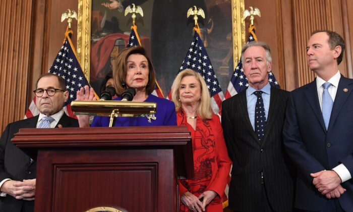 Speaker of the House Nancy Pelosi (C), flanked by House Permanent Select Committee on Intelligence Chairman Adam Schiff (R)(D-Calif.), House Judiciary Chairman Jerry Nadler (L) (D-N.Y.), House Foreign Affairs Committee Chairman Eliot Engel (2nd R) (D-N.Y.), House Financial Services Committee Chairwoman Maxine Waters (background)(D-Calif.), and House Committee on Oversight and Reform Chairwoman Carolyn Maloney (2nd R) (D-N.Y.), speaks as Democrats announced articles of impeachment against President Donald Trump during a press conference at the U.S. Capitol in Washington, on Dec. 10, 2019. (Saul Loeb/AFP via Getty Images)