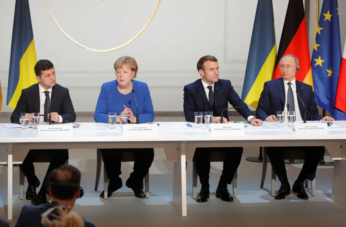 (L to R) Ukraine's President Volodymyr Zelenskiy , Germany's Chancellor Angela Merkel, France's President Emmanuel Macron and Russia's President Vladimir Putin attend a joint news conference after a Normandy-format summit in Paris, France December 9, 2019. (Charles Platiau/Pool/Reuters)