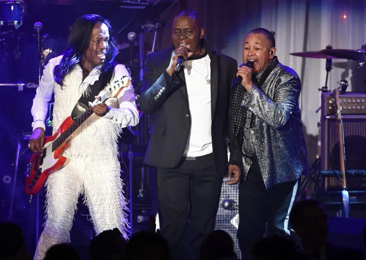 (L-R) Verdine White, Philip Bailey, and Ralph Johnson of Earth, Wind & Fire perform at the 2016 Clive Davis Pre-Grammy Gala in Beverly Hills, Calif., on Feb. 14, 2016. (Chris Pizzello/Invision/AP)