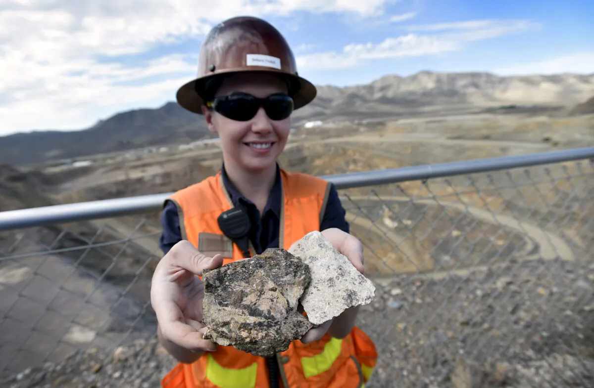 A piece of ore containing rare earths is displayed during a tour of a rare earth mineral mine in California on June 29, 2015. (David Becker/Reuters)