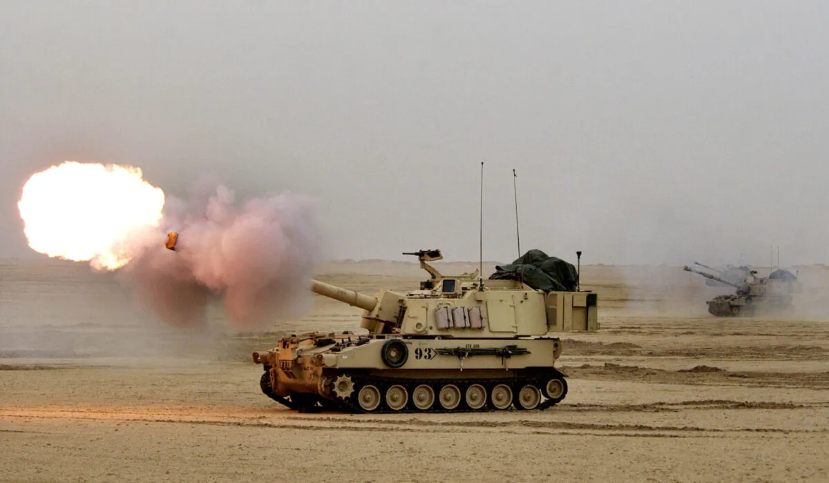 A U.S. Army Paladin M-109A6 155mm self-propelled Howitzer fires during live fire exercises near the Iraqi border in northern Kuwait on Feb. 13, 2003. (Scott Nelson/Getty Images)