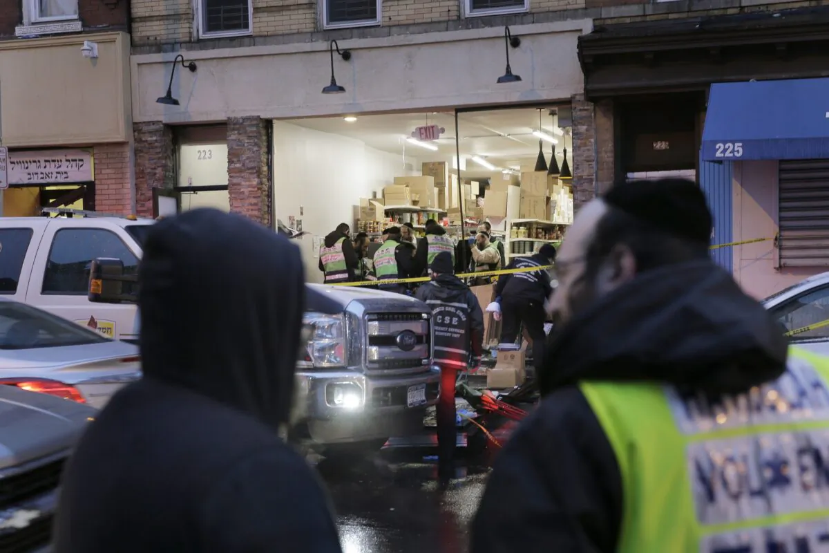 Emergency responders work at a kosher supermarket, the site of a shooting in Jersey City, N.J. on Dec. 11, 2019. (Seth Wenig/AP Photo)