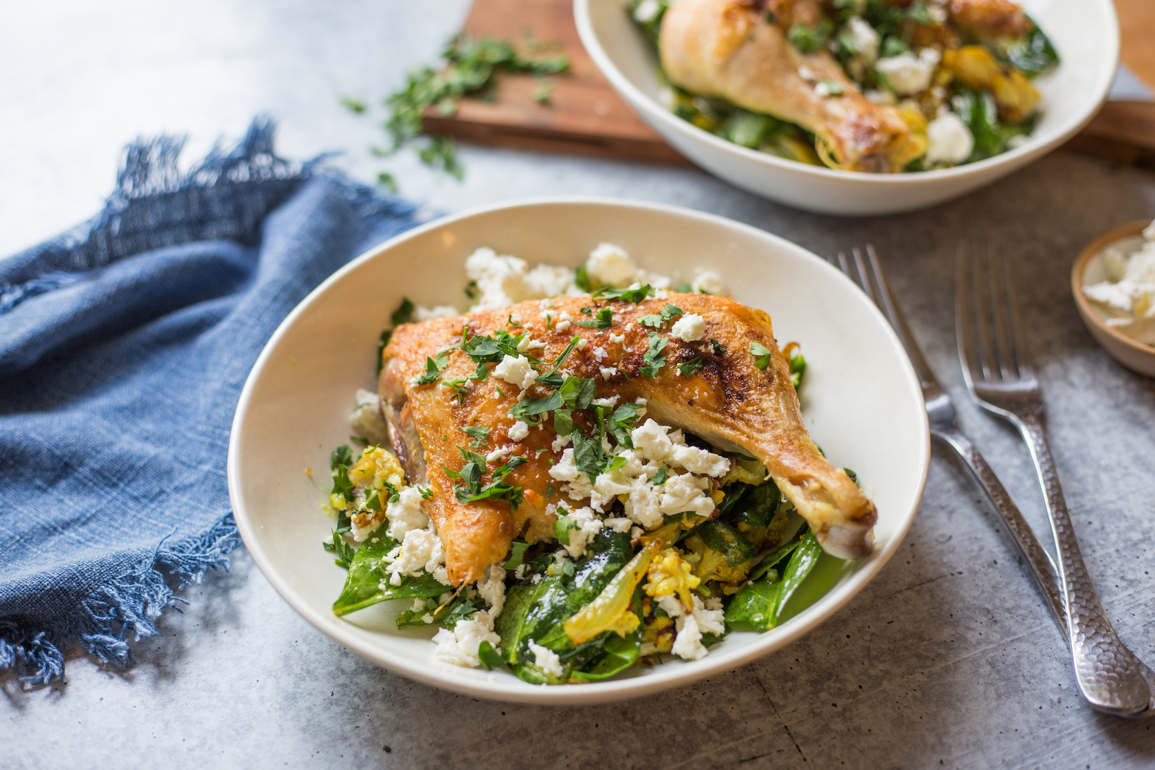 bowl of roasted chicken with feta and parsley