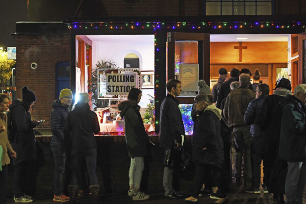 Voters queue outside St Andrews Church polling station in Balham,