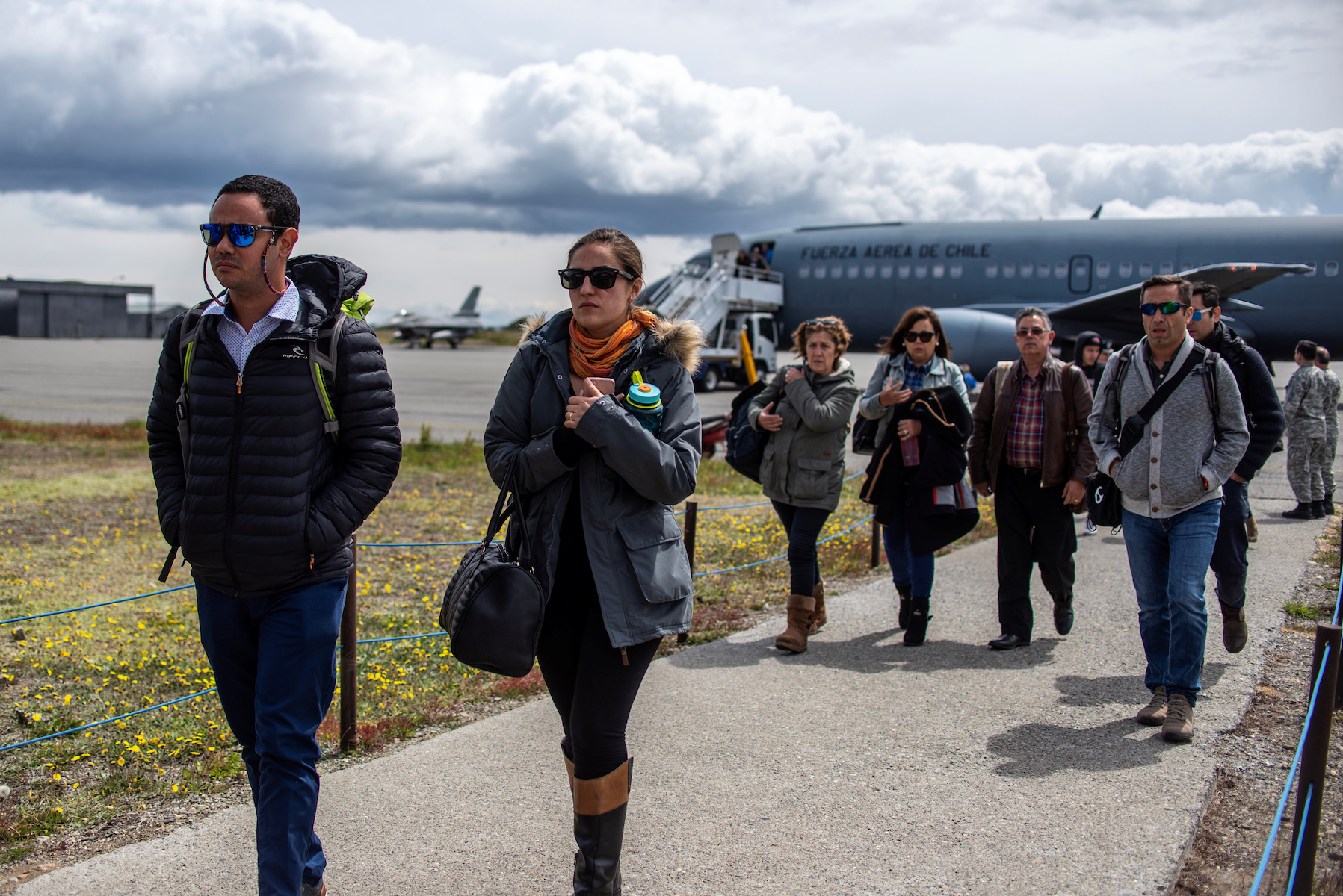 Relatives of passengers on the Hercules C-130 aircraft of Chile's Air Force that crashed arrive at an Air Force base in Punta Arenas city