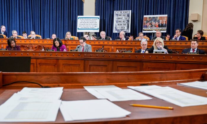 Documents including copies of House Resolution 755 "Articles of Impeachment Against President Donald J. Trump," are seen as the House Judiciary Committee continues its markup of articles of impeachment against President Donald Trump on Capitol Hill in Washington on Dec. 12, 2019. (Joshua Roberts/Reuters)