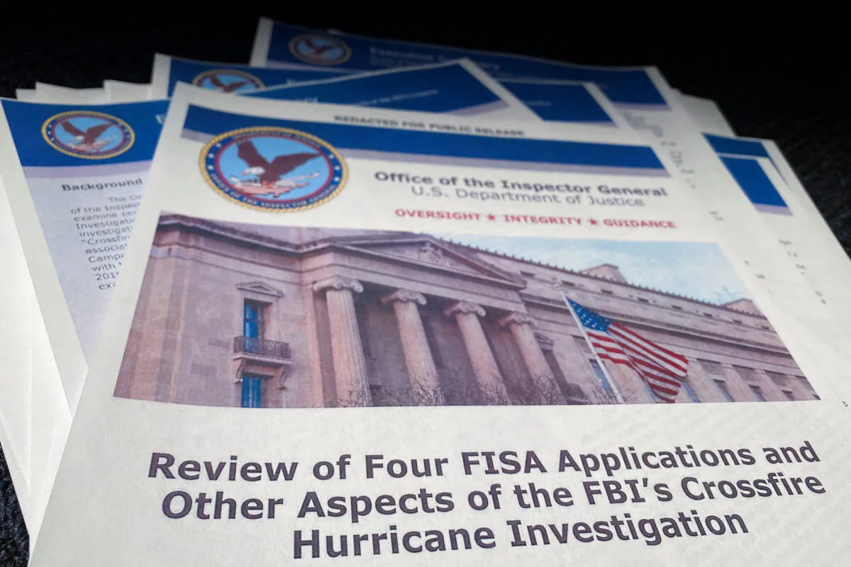 U.S. Justice Department Inspector General Michael Horowitz's report, titled "Review of Four FISA Applications and Other Aspects of the FBI's Crossfire Hurricane Investigation" in Washington, on Dec. 9, 2019. (Jim Bourg/Reuters)