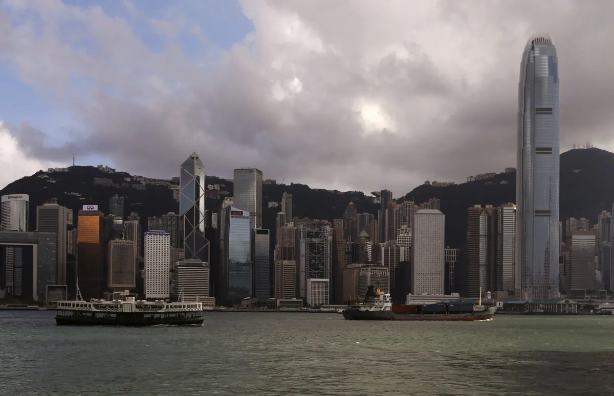 A Star Ferry sails past Hong Kong's business Central district June 18, 2014. (Bobby Yip/Reuters)
