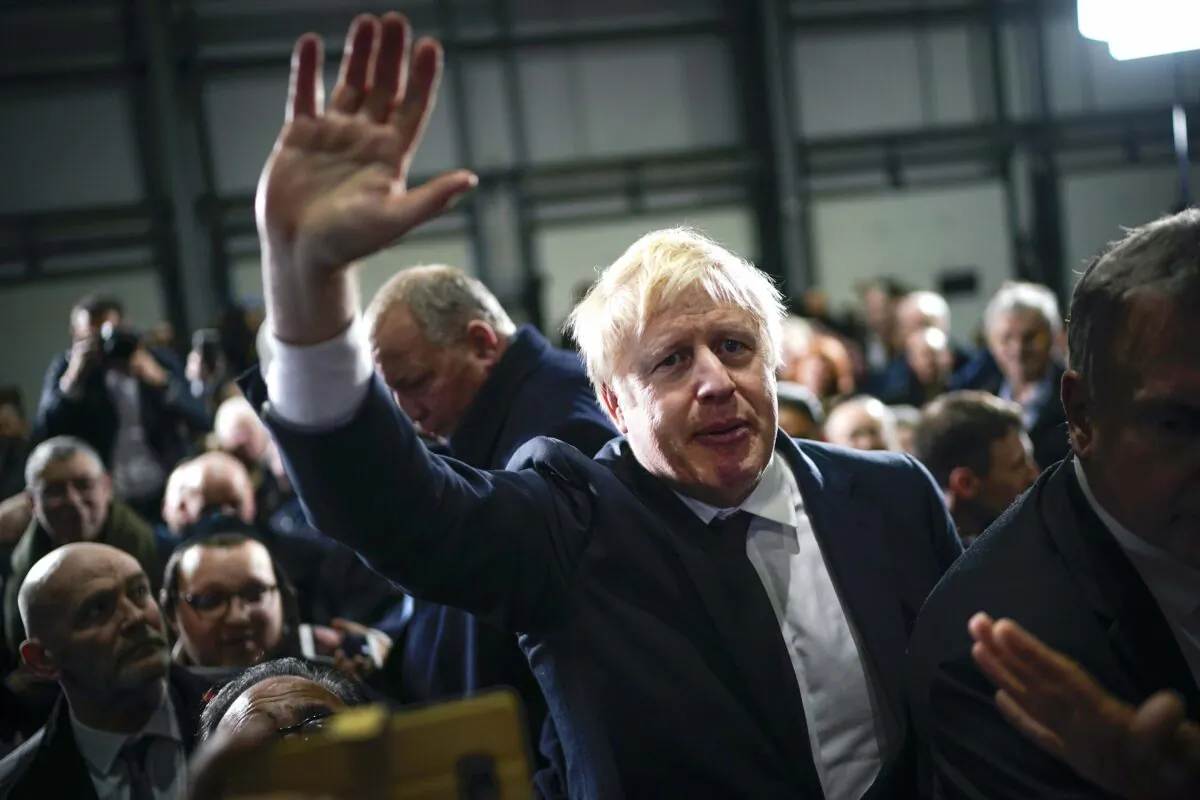 British Prime Minister Boris Johnson is applauded by supporters after speaking at the Globus Group factory in Manchester, England, on Dec. 10, 2019. (Christopher Furlong/Getty Images)