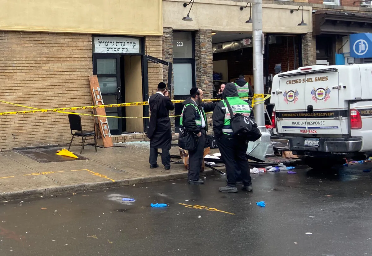 A picture of the scene the day after an hours-long gun battle with two shooters around a kosher market in Jersey City, New Jersey on Dec. 11, 2019. (Lloyd Mitchell/Reuters)