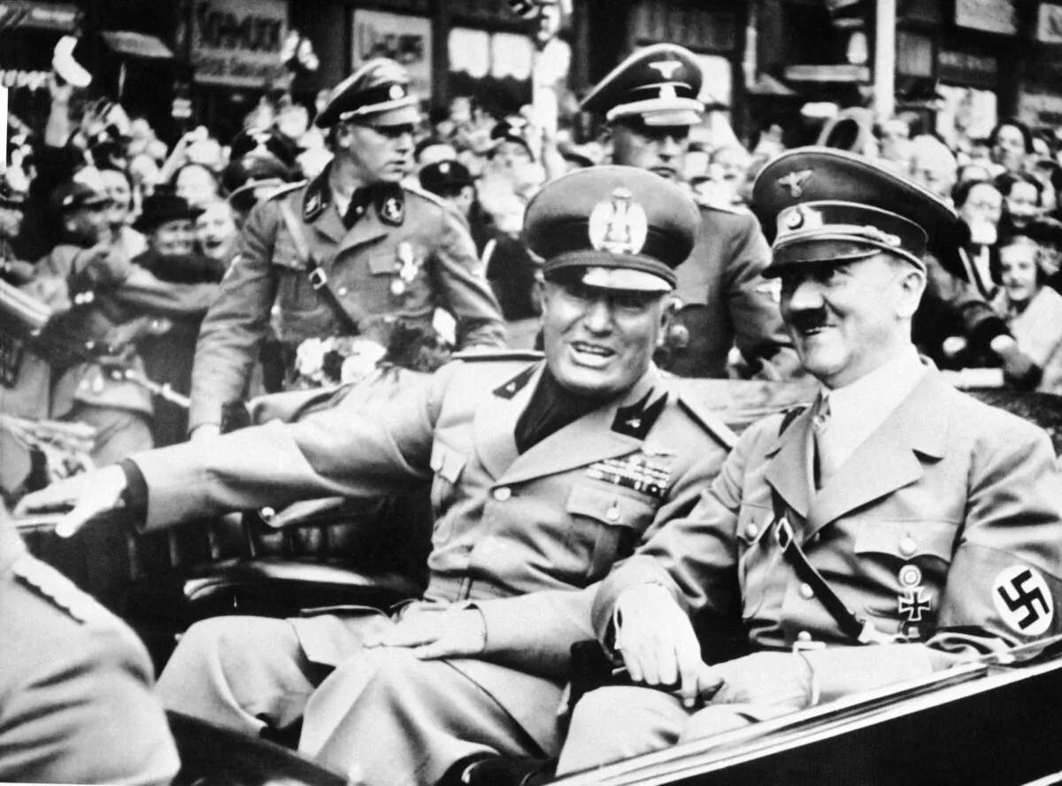 Italian dictator and National Fascist Party leader Benito Mussolini (L) rides in a car with Nazi leader Adolf Hitler in Munich, Germany, on Sept. 28, 1938. (AP Photo/File)