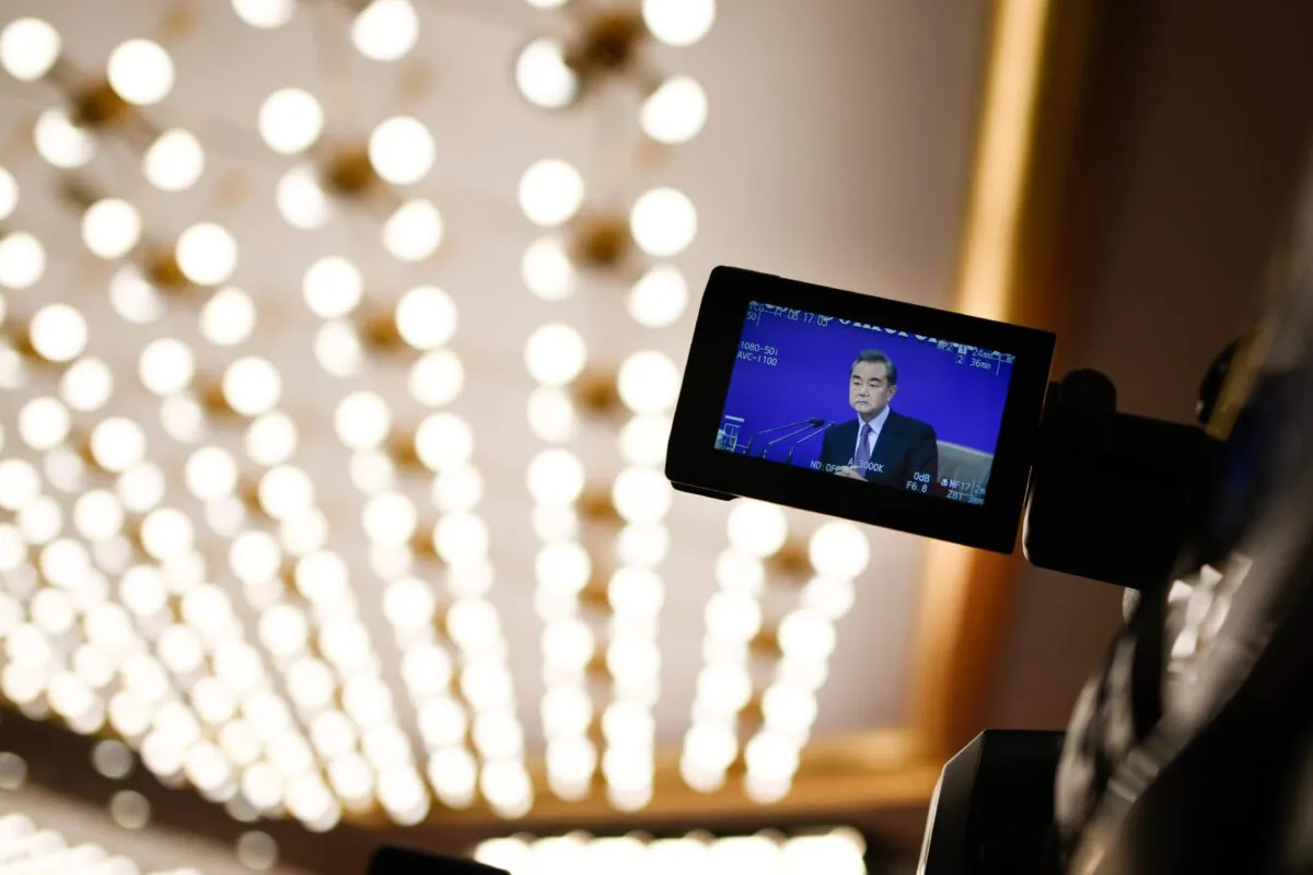 A camera monitor shows China's Foreign Minister Wang Yi answering a question during a National People's Congress press conference in Beijing on March 8, 2019. (WANG ZHAO/AFP via Getty Images)