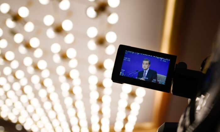 A camera monitor shows China's Foreign Minister Wang Yi answering a question during a National People's Congress press conference in Beijing on March 8, 2019. (WANG ZHAO/AFP via Getty Images)