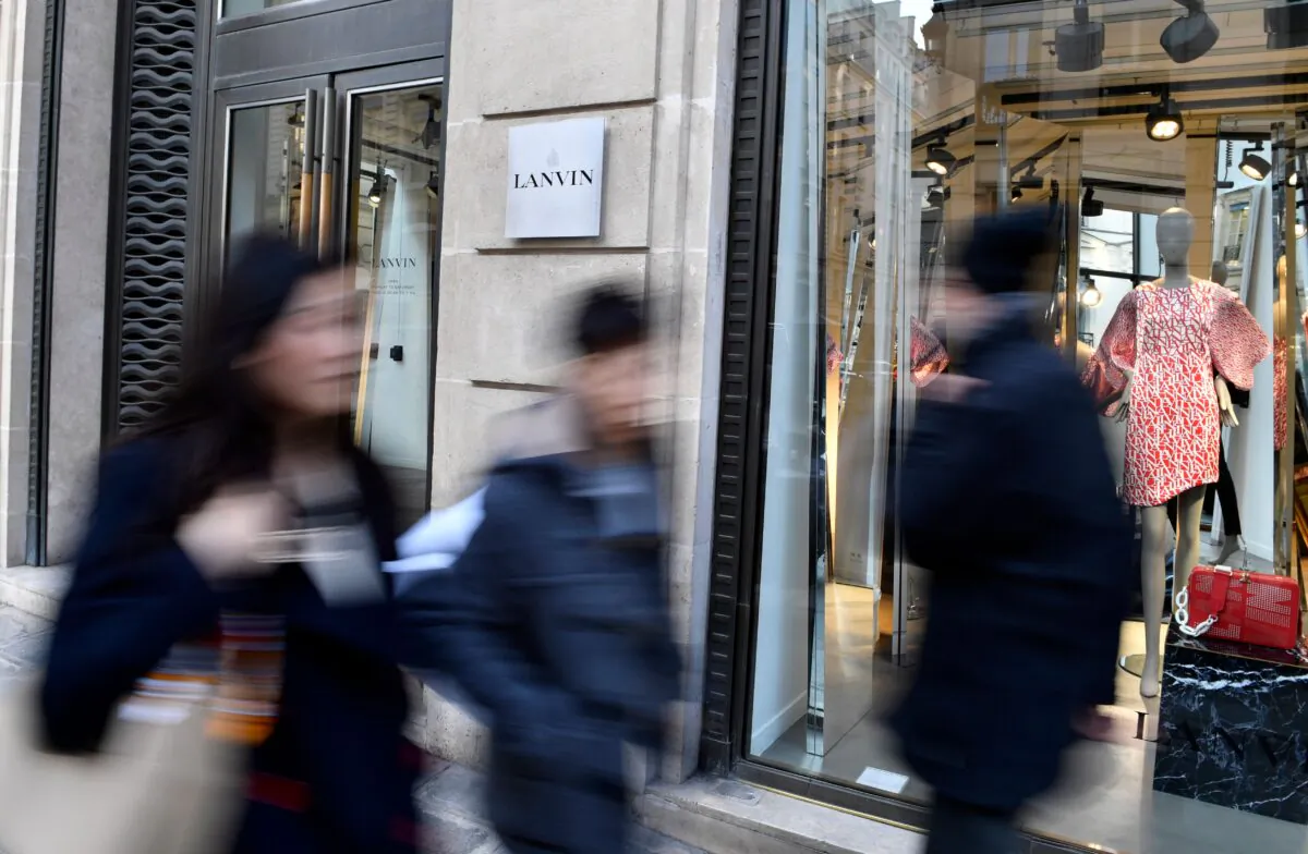 Pedestrians walk past a Lanvin shop on the Rue du Faubourg Saint-Honore in Paris on Feb. 22, 2018. 
Chinese conglomerate Fosun, which snapped up the French fashion label in 2018, has failed to turn the business around. 
(Gerard Julien/AFP via Getty Images)