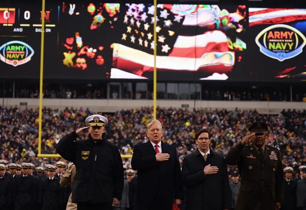 President Donald Trump (C), with US Defense Secretary Mark Esper (C R), sings the National Anthem before the Army v. Navy American Football game in Philadelphia on Dec. 14, 2019. (ANDREW CABALLERO-REYNOLDS/AFP via Getty Images)