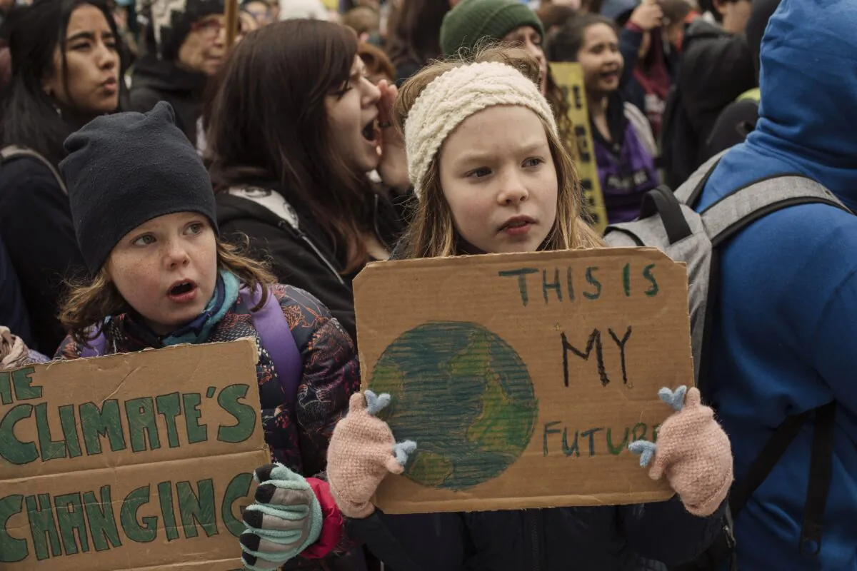 Schoolchildren take part in a climate-change protest in Edmonton on Sept. 27, 2019. We educate students when we help them think for themselves, but we indoctrinate them if we make them think like us. (The Canadian Press/Amber Bracken)