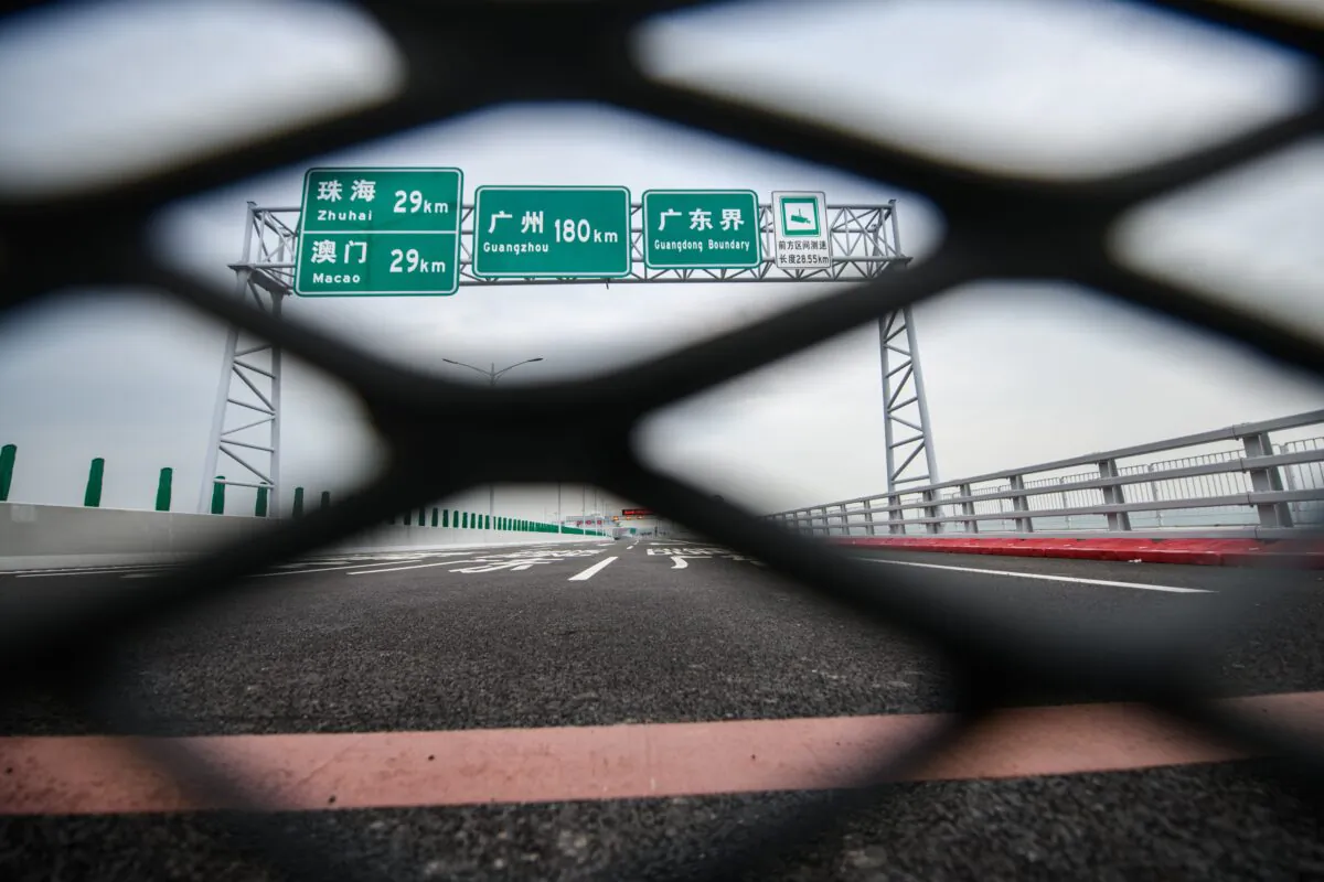 A barrier in place before a red line (bottom) showing the crossing boundary from the Hong Kong side of the Hong Kong-Zhuhai-Macau Bridge (HKZM) on October 19, 2018. (ANTHONY WALLACE/AFP via Getty Images)