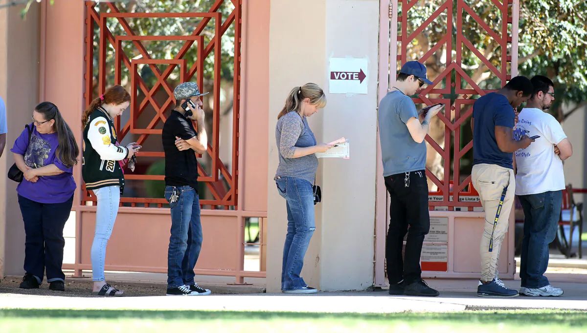 Arizona voters wait in line to cast their ballot at a polling place during the midterm elections in Phoenix, Ariz., on Nov. 6, 2018. (Ralph Freso/Getty Images)