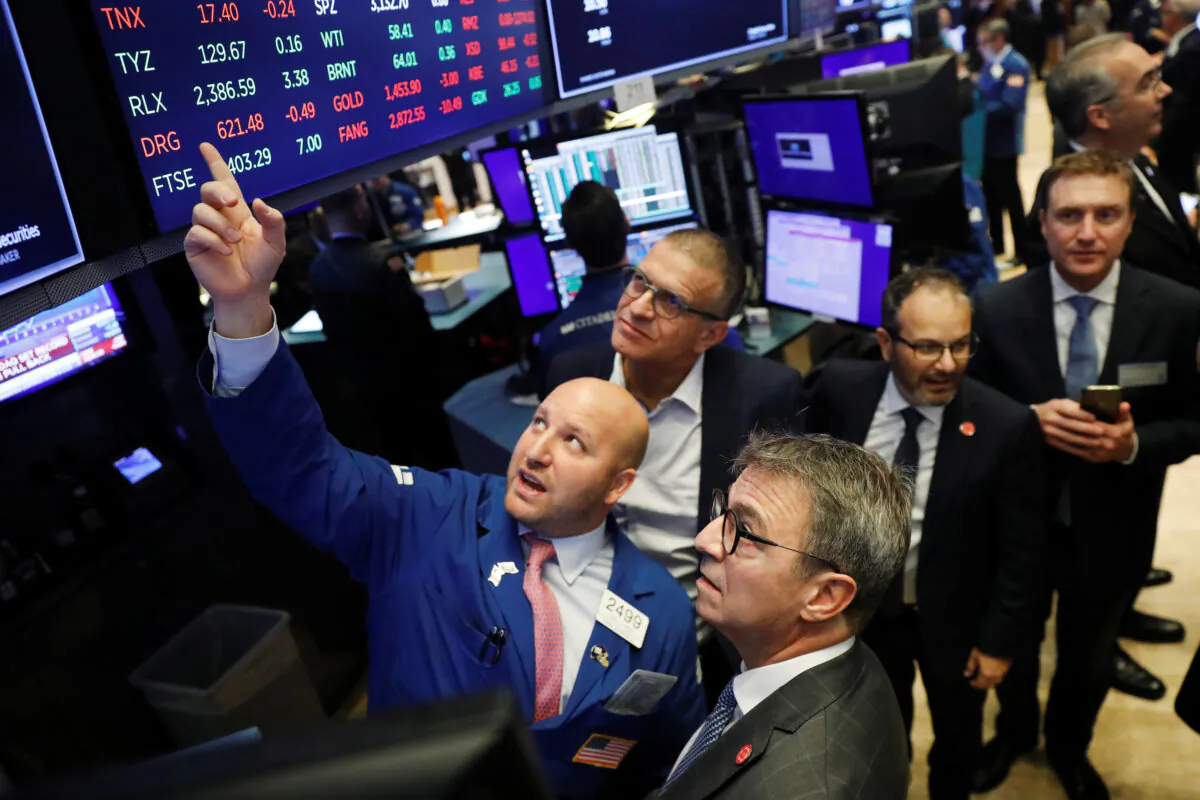 Chief Executive Officer of Kaleyra, Dario Calogero, looks up at a board before the company's IPO above the floor of the New York Stock Exchange shortly after the opening bell in New York, U.S., on Nov. 26, 2019. (Lucas Jackson/Reuters)