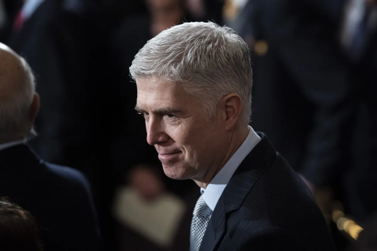 U.S. Supreme Court Associate Justice Neil M. Gorsuch waits for the arrival of former U.S. President George H.W. Bush at the U.S. Capitol Rotunda in Washington, on Dec. 3, 2018. (Jabin Botsford - Pool/Getty Images)