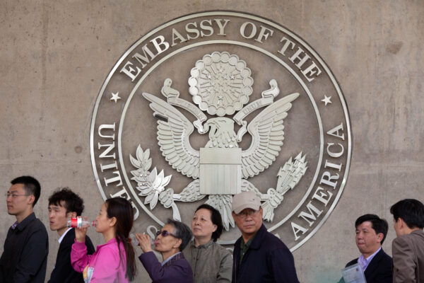 People queue outside the U.S. embassy in B