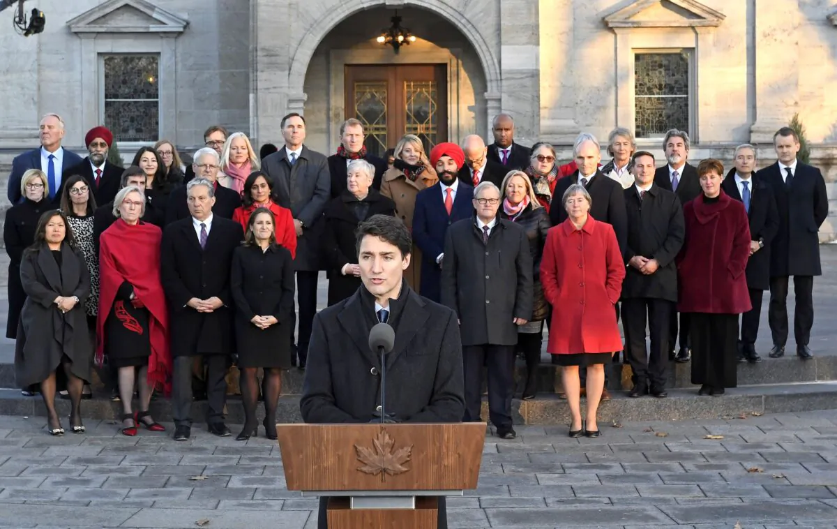 Prime Minister Justin Trudeau speaks as Liberal cabinet ministers look on following the swearing-in of the new cabinet at Rideau Hall in Ottawa on Nov. 20, 2019. (The Canadian Press/Adrian Wyld)