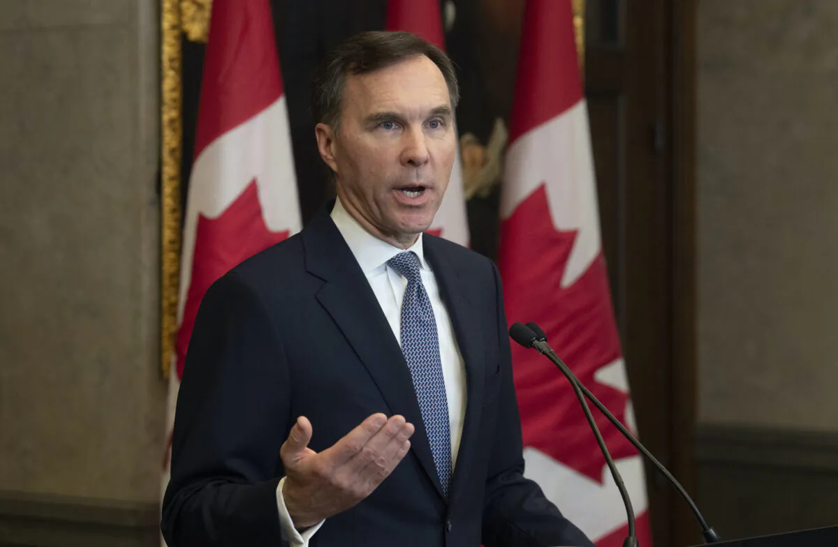 Minister of Finance Bill Morneau speaks with reporters after providing the government’s fiscal update in Ottawa on Dec. 16, 2019. The Liberals are committed to more spending even as deficits rise and the economy remains resilient. (The Canadian Press/Adrian Wyld)