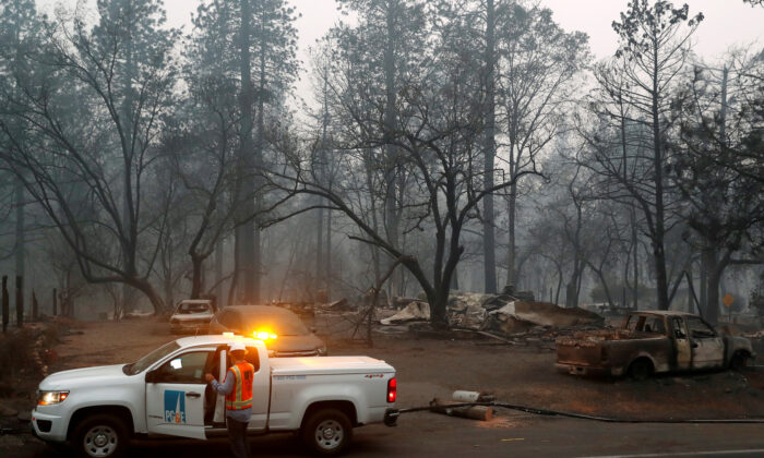 Employees of Pacific Gas & Electric work in the aftermath of the Camp Fire in Paradise, California, Nov. 14, 2018.  (Reuters/Terray Sylvester/File Photo)