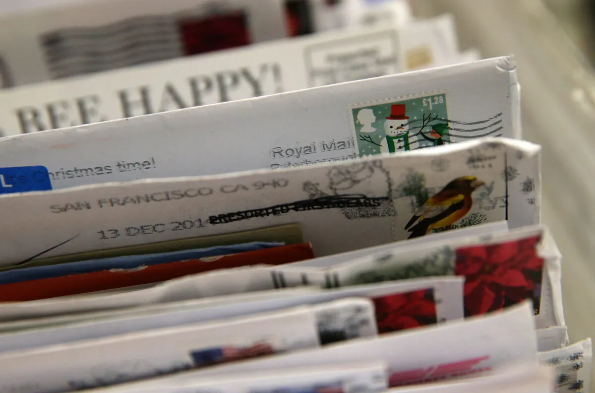 Holiday stamps are seen on mail at the U.S. Post Office sort center in San Francisco, California, on Dec. 18, 2014. (Justin Sullivan/Getty Images)