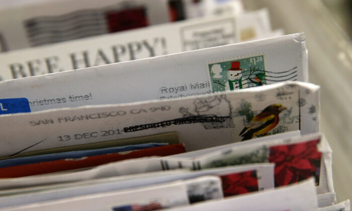 Holiday stamps are seen on mail at the U.S. Post Office sort center in San Francisco, California, on Dec. 18, 2014. (Justin Sullivan/Getty Images)