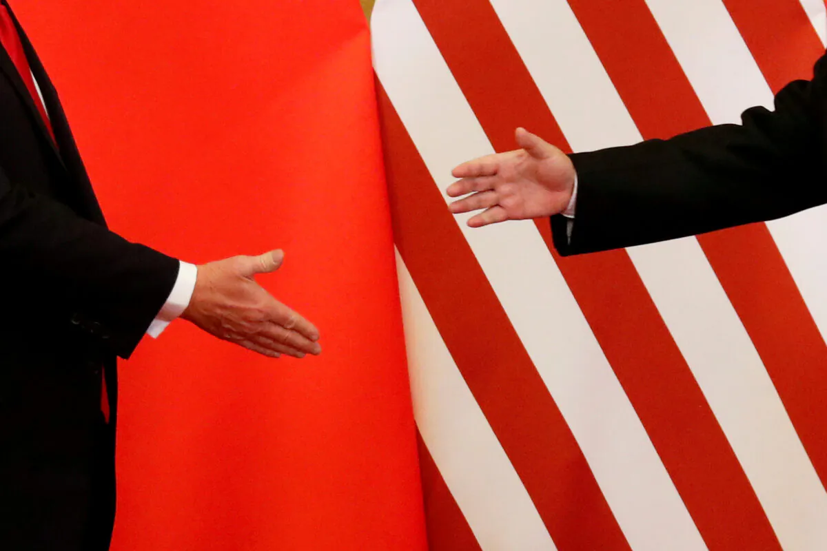 U.S. President Donald Trump and China's leader Xi Jinping shake hands after making joint statements at the Great Hall of the People in Beijing, China on Nov. 9, 2017. (Damir Sagolj/Reuters)