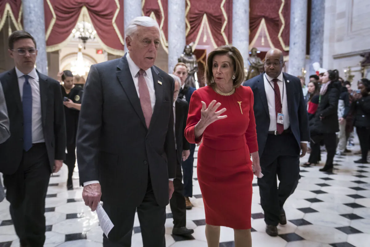 House Majority Leader Rep. Steny Hoyer (D-Md.) and House Speaker Nancy Pelosi (D-Calif.) walk from the House floor where members debate the United States–Mexico–Canada Agreement (USMCA) to the speaker's office in the Capitol on Dec. 19, 2019. (Sarah Silbiger/Getty Images)