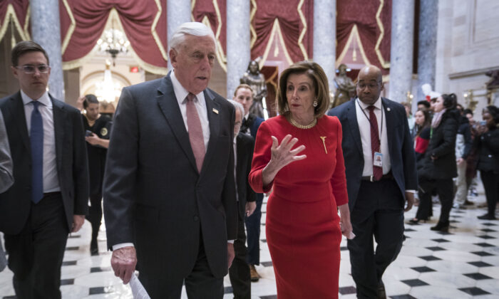 House Majority Leader Rep. Steny Hoyer (D-Md.) and House Speaker Nancy Pelosi (D-Calif.) walk from the House floor where members debate the United States–Mexico–Canada Agreement (USMCA) to the speaker's office in the Capitol on Dec. 19, 2019. (Sarah Silbiger/Getty Images)