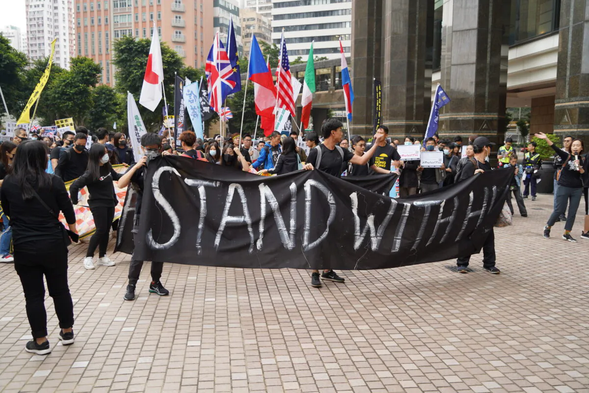 Hong Kong protesters march to foreign diplomatic missions, in Hong Kong, on December 19, 2019. (Ivan Chan/The Epoch Times)