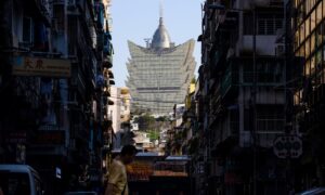 Beijing Celebrates Obedient Macau as Hong Kong Racked by Protests