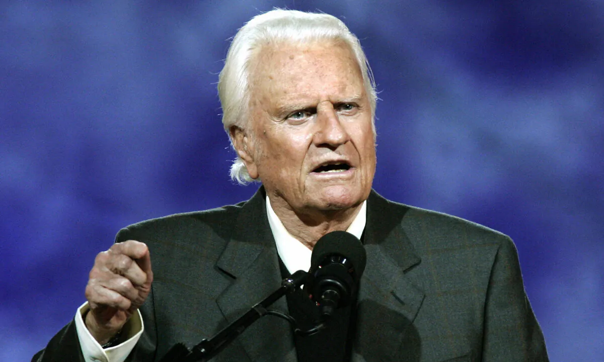 Evangelist Billy Graham delivers his message during the Billy Graham Crusade at Flushing Meadows Park in Flushing Meadows, New York, on June 24, 2005. (Timothy A. Clary/AFP via Getty Images)