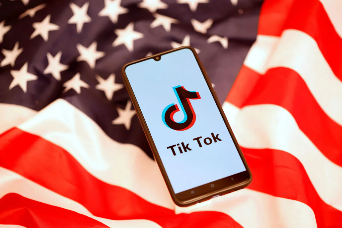 TikTok logo displayed on a smartphone on the U.S. flag on Nov. 8, 2019. (Reuters/Dado Ruvic)