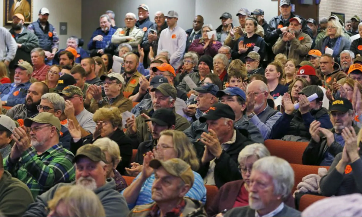 Spectators applaud as the Buckingham County Board of Supervisors unanimously voted to pass a Second Amendment Sanctuary City resolution at a meeting in Buckingham , Va., Monday, Dec. 9, 2019. (Steve Helber/AP Photo)