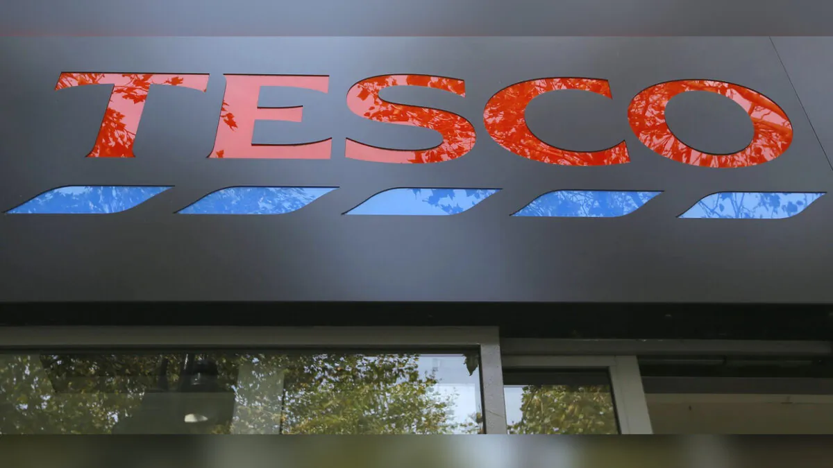 The sign on a Tesco shop is photographed, in London, on Sept. 22, 2014. (Kirsty Wigglesworth/AP Photo)