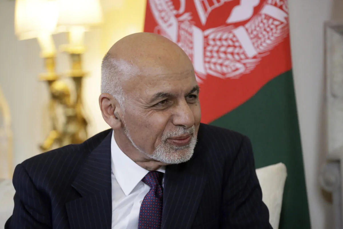 Afghanistan's President Ashraf Ghani speaks with British Prime Minister Theresa May at the start of their meeting inside 10 Downing Street in London on June 17, 2019. June 17, 2019. (Matt Dunham/AP/Pool-File)