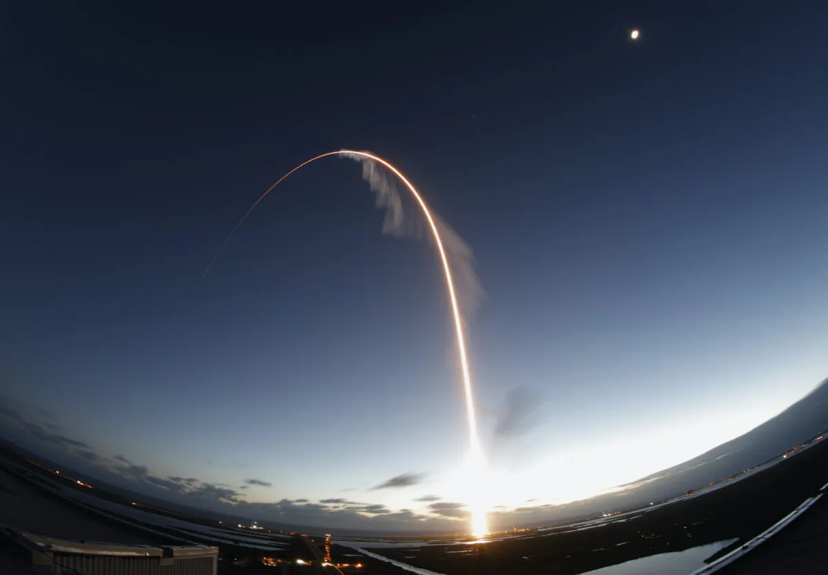 In this long exposure photo, the United Launch Alliance Atlas V rocket carrying the Boeing Starliner crew capsule lifts off on an orbital flight test to the International Space Station from Space Launch Complex 41 at Cape Canaveral Air Force station, in Cape Canaveral, Fla., on Dec. 20, 2019. (Terry Renna/AP)