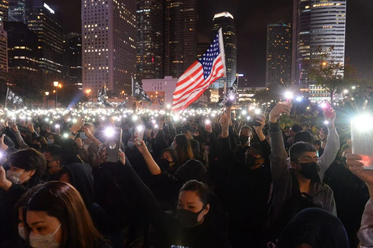 Pro-democracy protesters take part in a rally to support Spark Alliance, a fundraising platform that has been accused of money laundering and had its funds frozen by authorities, in Hong Kong on Dec. 23, 2019. (Philip Fong/AFP via Getty Images)
