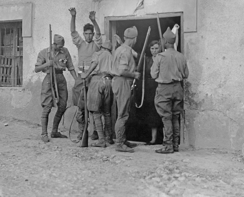 Nationalist troops search a farmer and his wife for weapons after the capture of the Basque town of Irún during the Spanish Civil War on Sept. 6, 1936.  (Keystone/Hulton Archive/Getty Images)
