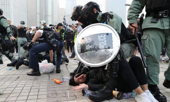 Clashes as Police Try to Clear Hong Kong Protesters After Uyghur Support Rally