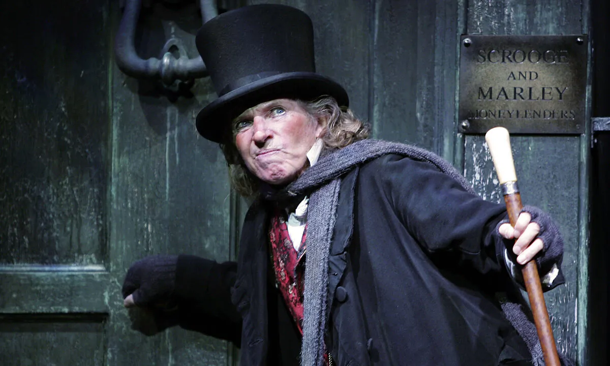 Actor Tommy Steele poses at a photocall to promote his role as Ebenezer Scrooge at the London Palladium in London, on Oct. 27, 2005. M.J. Kim/Getty Images