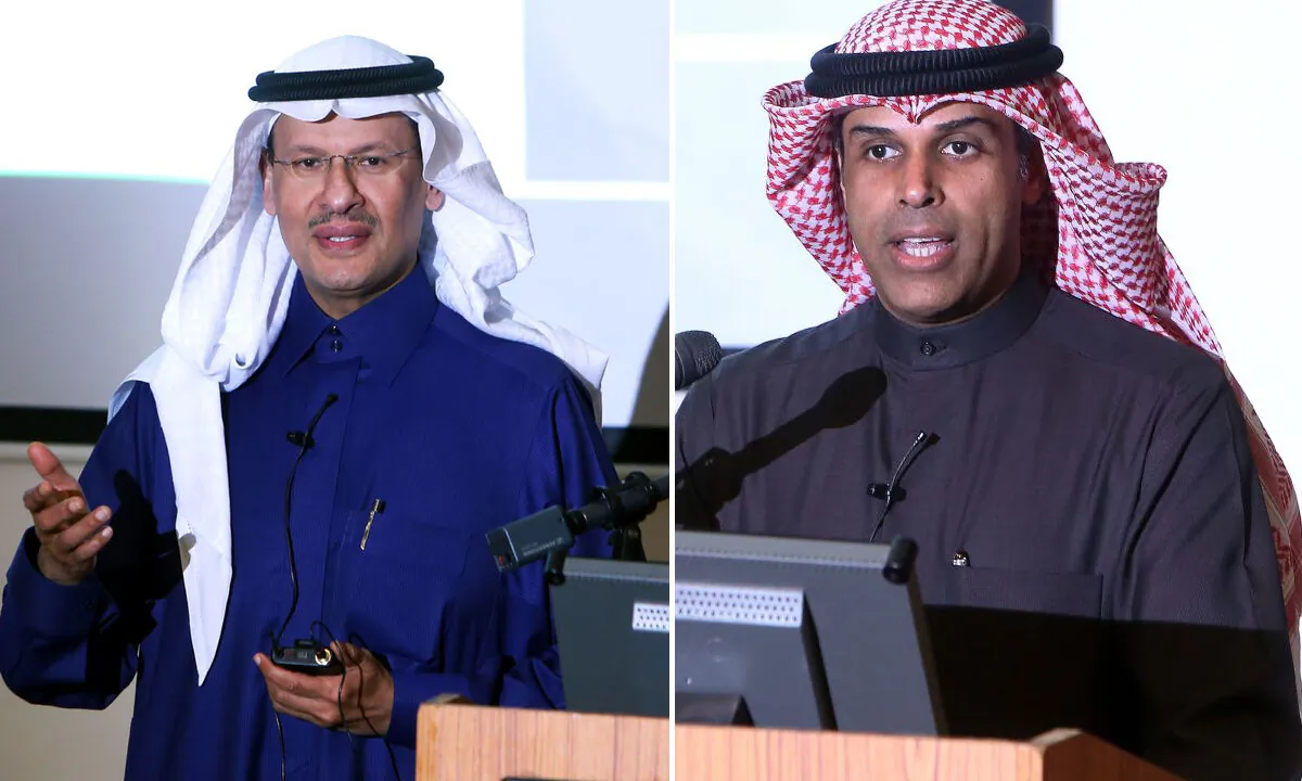 Kuwaiti Oil Minister Khaled al-Fadhel (R) and Saudi Oil Minister Prince Abdulaziz bin Salman (L) speak during a ceremony marking the signing of an agreement to reproduce oil in the neutral zone between Kuwait and Saudi Arabia, at Wafra about 100 kilometres south of Kuwait City on Dec. 24, 2019. (YASSER AL-ZAYYAT/AFP via Getty Images)