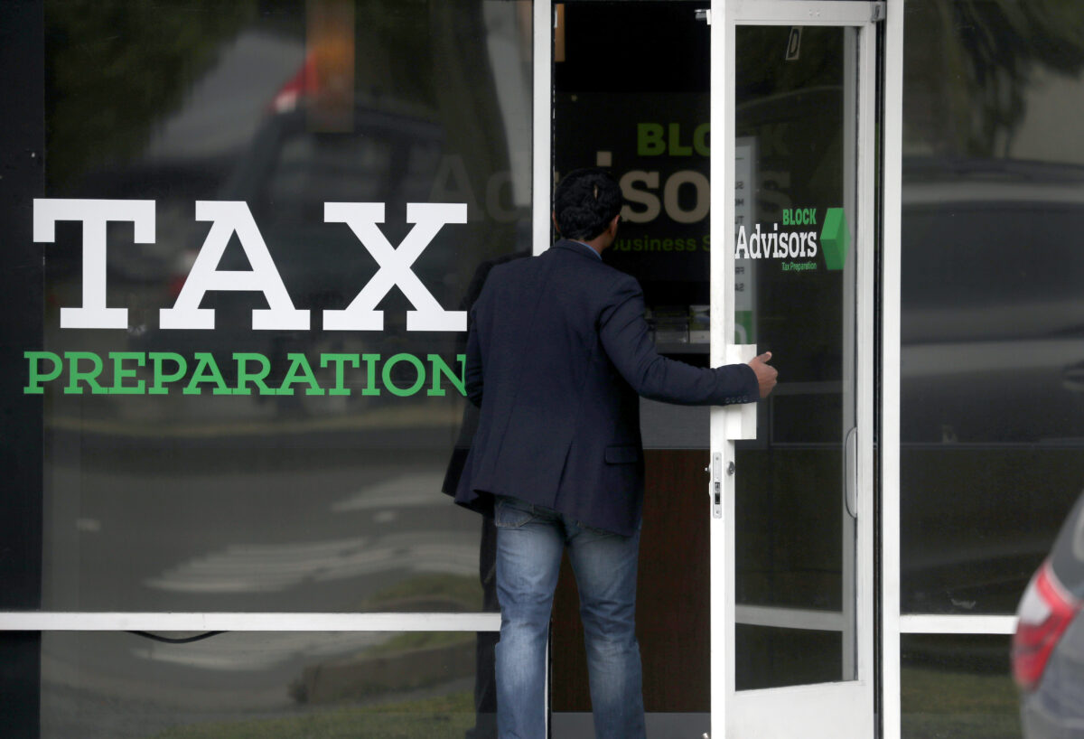 A customer enters a tax preparation office